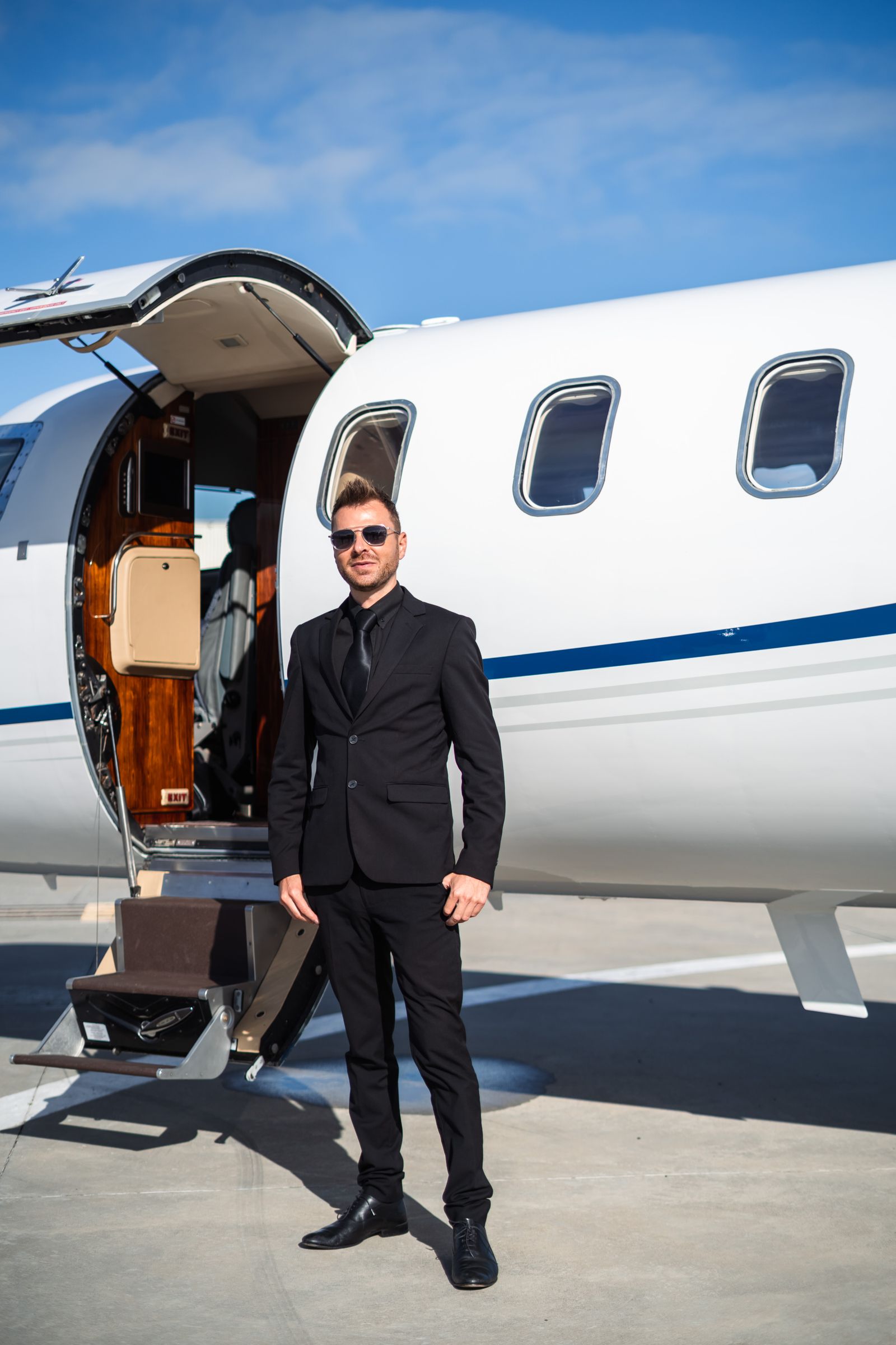 Client welcomed at the foot of a private jet, on the tarmac